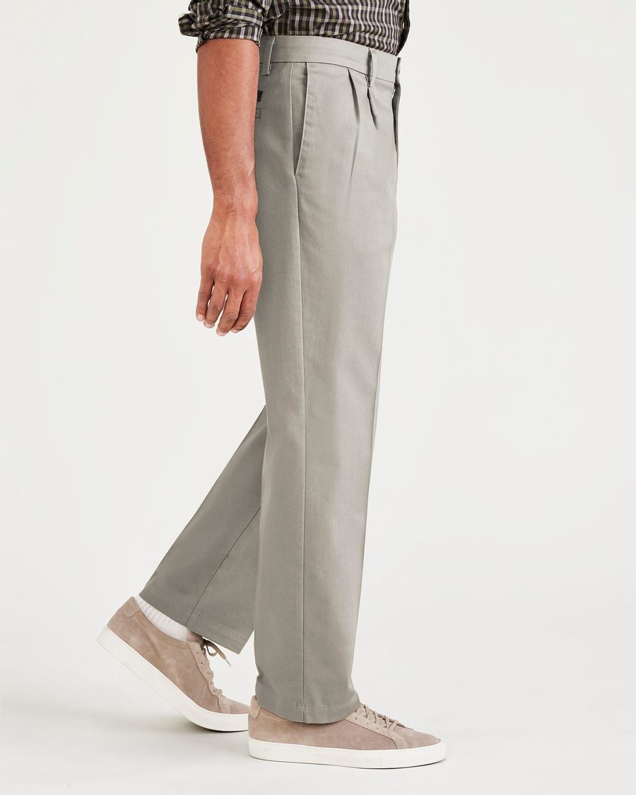 Side view of model wearing Cloud Signature Iron Free Khakis, Pleated, Classic Fit with Stain Defender® (Big and Tall).