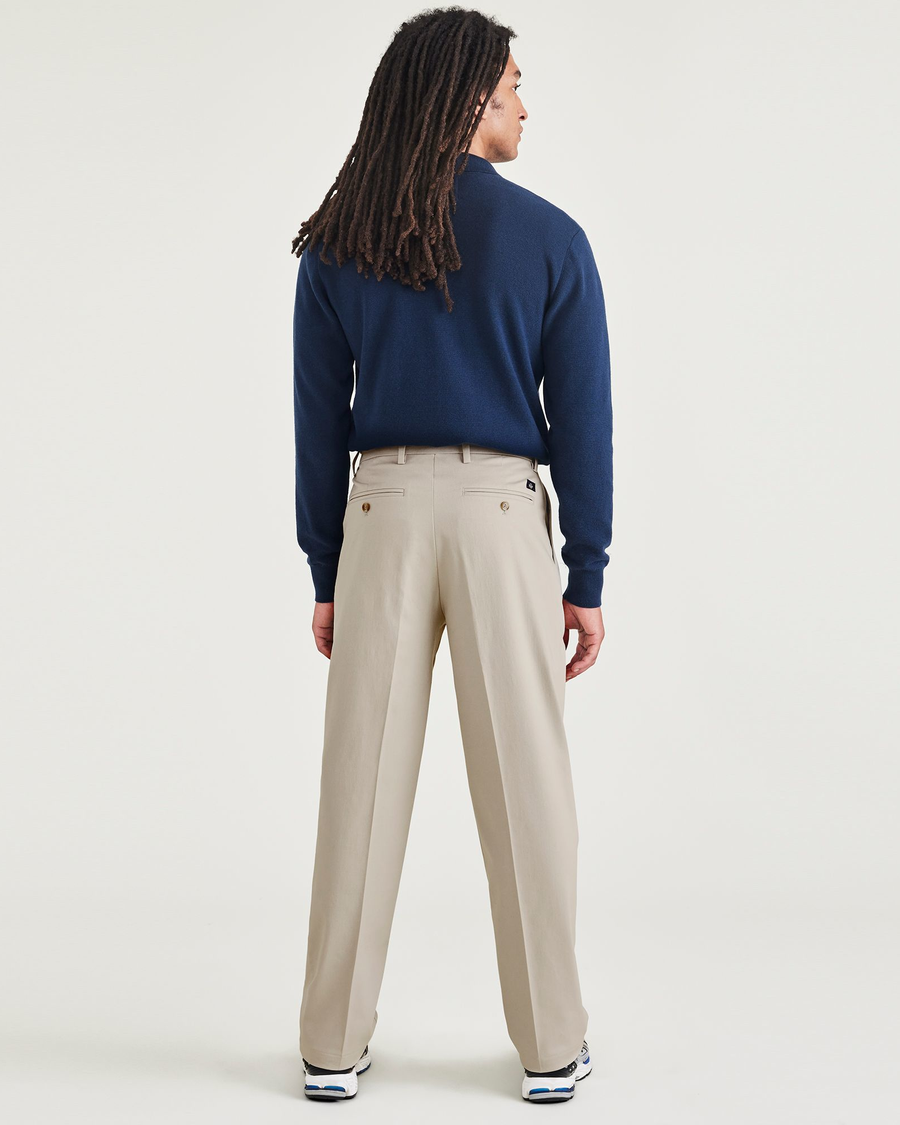 Back view of model wearing Cloud Signature Iron Free Khakis, Pleated, Relaxed Fit with Stain Defender®.