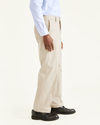 Side view of model wearing Cloud Signature Khakis, Classic Fit.