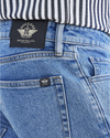 View of model wearing Coastal Stretch Jean Cut Pants, Slim Fit.