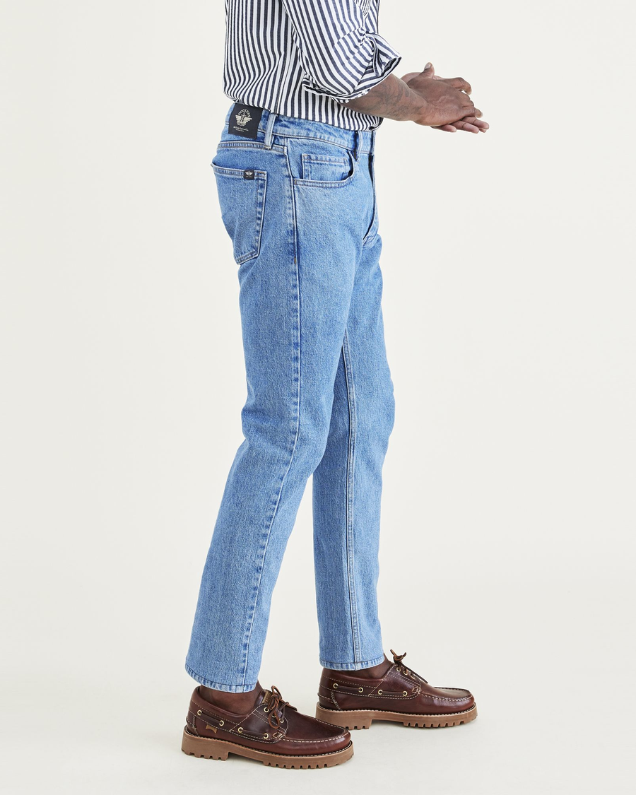 Side view of model wearing Coastal Stretch Jean Cut Pants, Slim Fit.