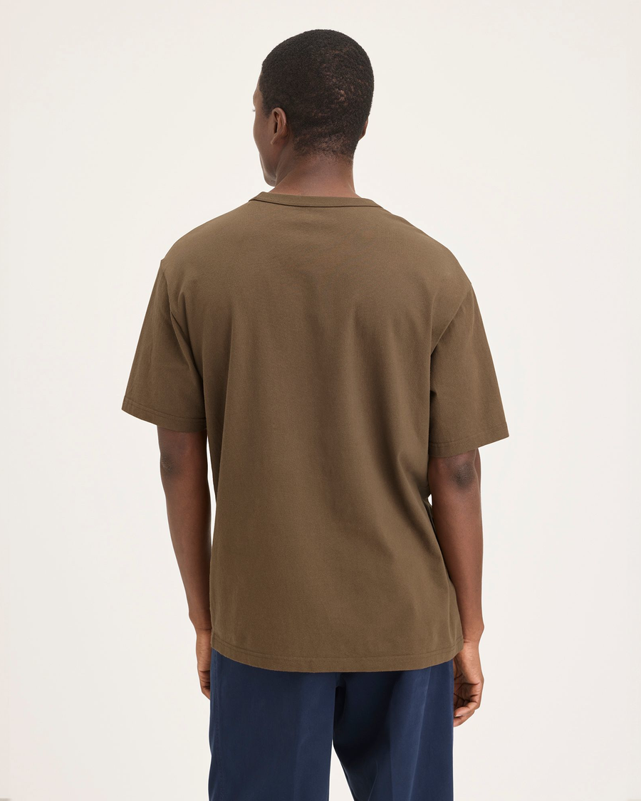 Back view of model wearing Coffee Liquor Eighty-Six Tee, Relaxed Fit.