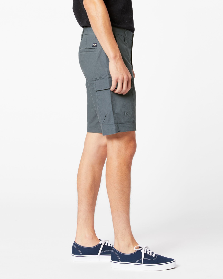 Side view of model wearing Cool Slate Tech Cargo 9" Shorts.
