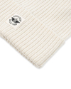 View of  Cream Recycled Double Knit Ribbed Beanie w/ Woven Seasonal Graphic.