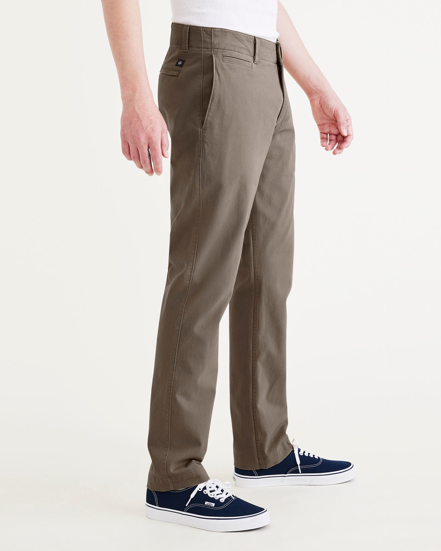 Side view of model wearing Crocodile Stone Wash California Khakis, Slim Fit.