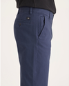 Side view of model wearing Crown Blue Ultimate Chinos, Straight Fit.