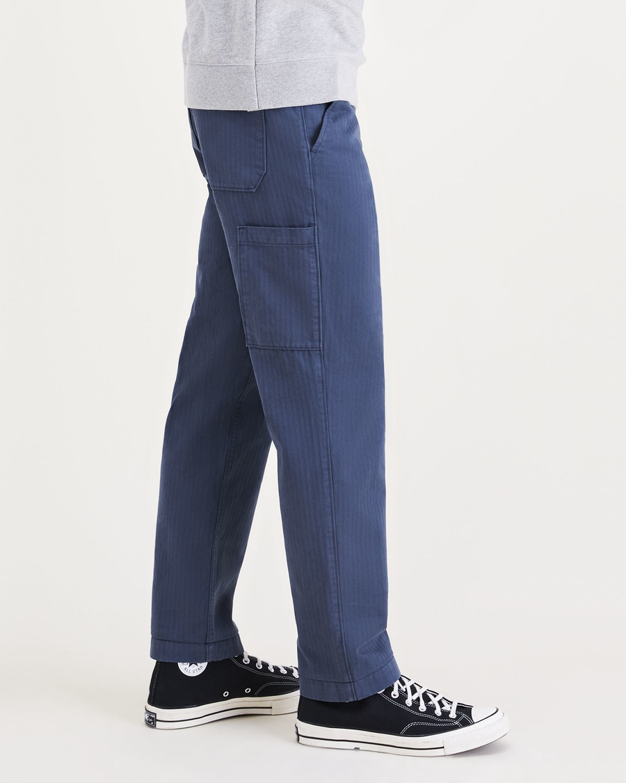 Side view of model wearing Dark Blue California Carpenter Pants, Straight Fit.