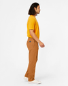 Side view of model wearing Dark Ginger Ultimate Chinos, Straight Fit.