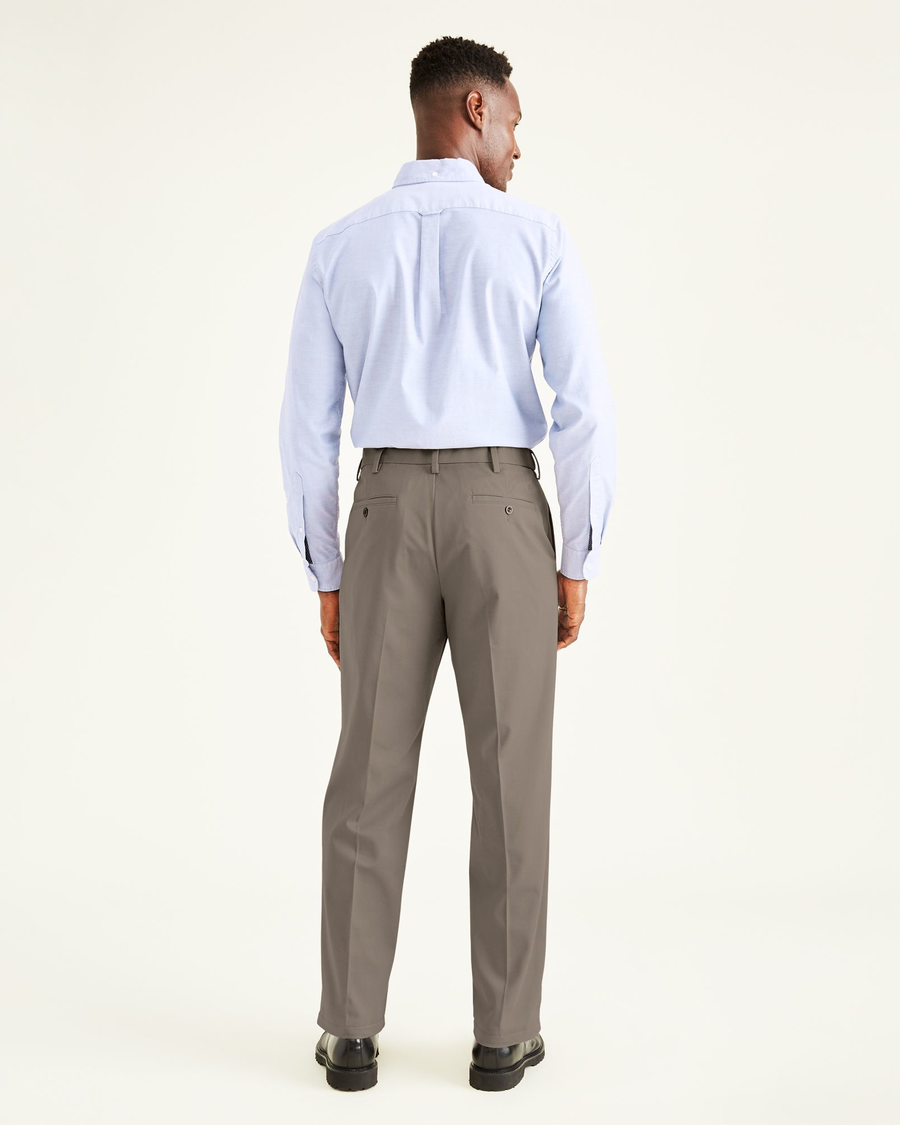 Back view of model wearing Dark Pebble Easy Khakis, Classic Fit.