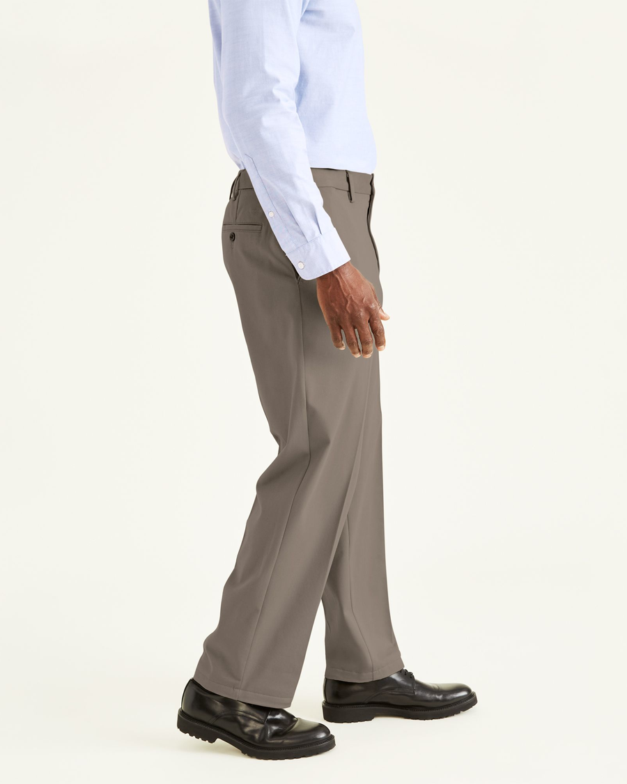 Side view of model wearing Dark Pebble Easy Khakis, Classic Fit.