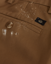 View of model wearing Dark Pebble Signature Iron Free Khakis, Straight Fit with Stain Defender® (Big and Tall).