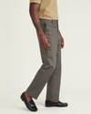 Side view of model wearing Dark Pebble Signature Iron Free Khakis, Straight Fit with Stain Defender® (Big and Tall).