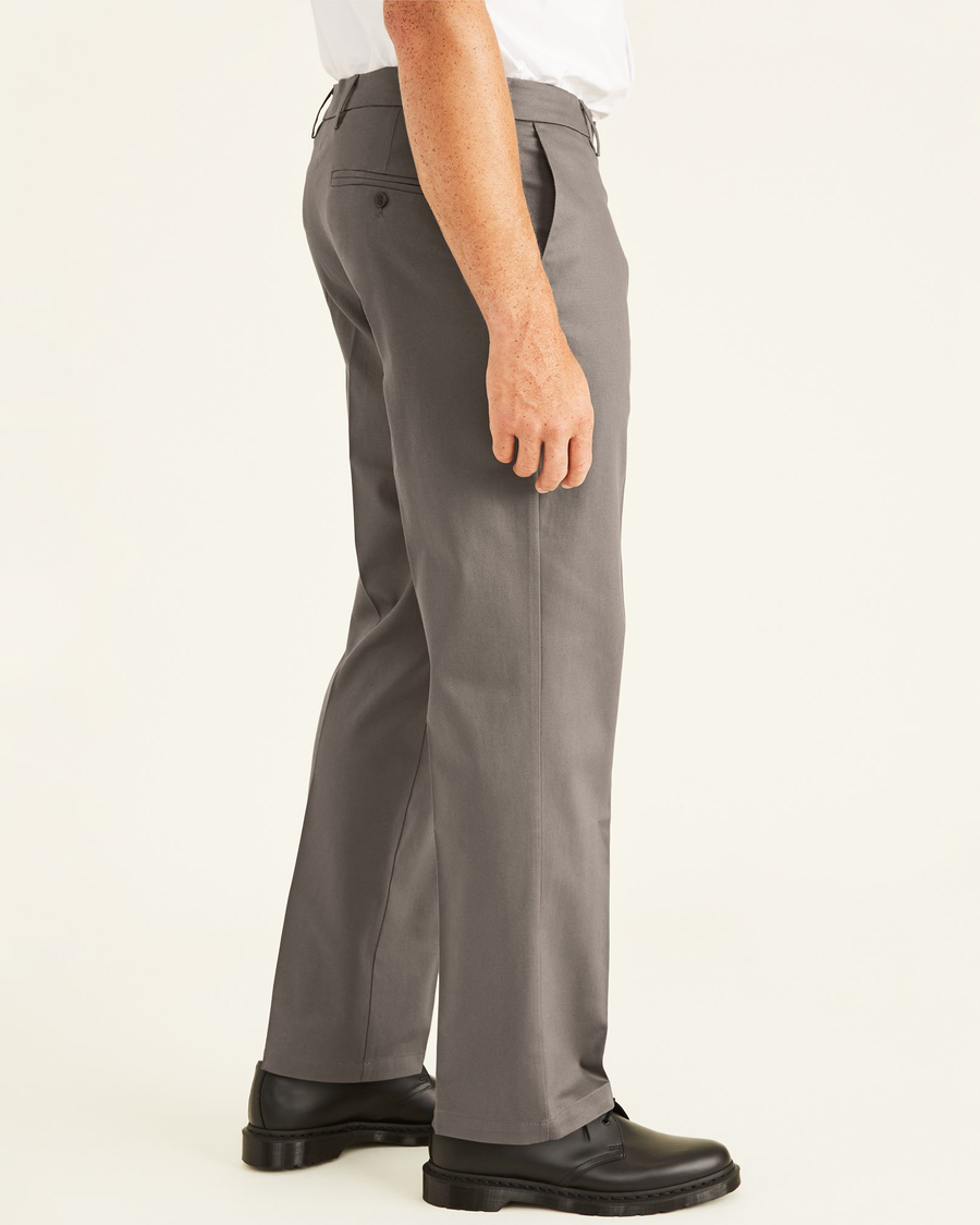 Side view of model wearing Dark Pebble Signature Khakis, Classic Fit (Big and Tall).