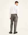 Back view of model wearing Dark Pebble Signature Khakis, Pleated, Classic Fit (Big and Tall).