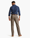 Back view of model wearing Dark Pebble Signature Khakis, Straight Fit.