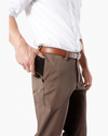 View of model wearing Dark Pebble Workday Khakis, Classic Fit.