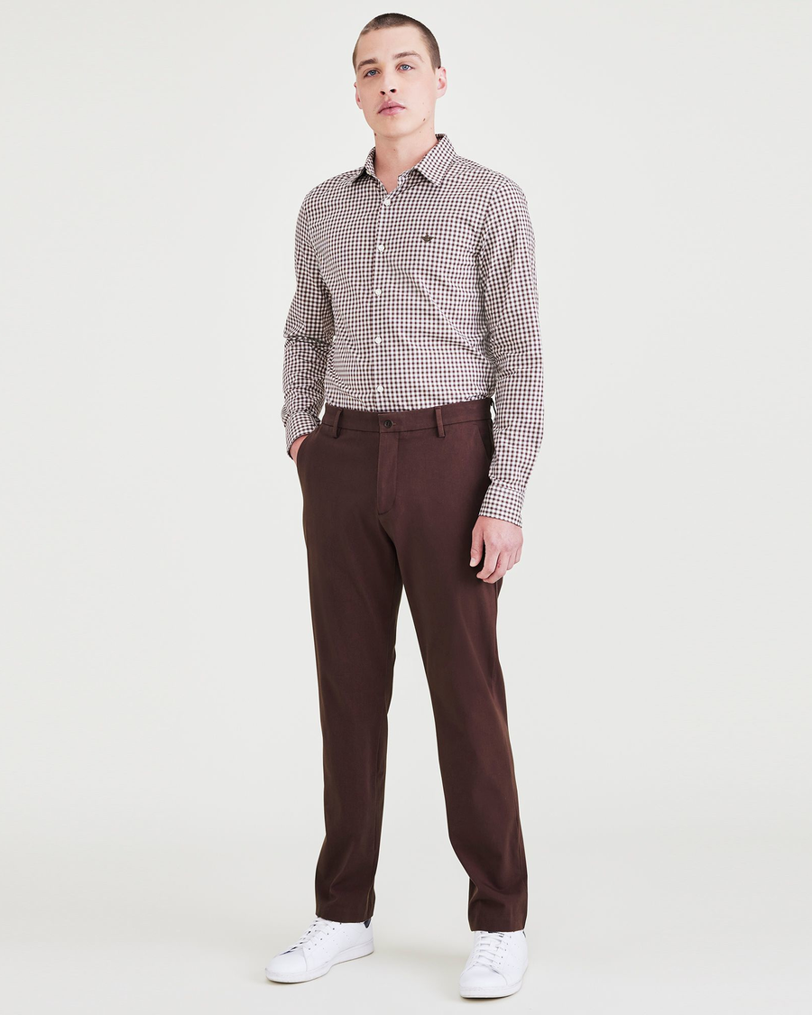 Front view of model wearing Decadent Chocolate City Tech Trousers, Slim Fit.