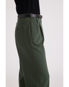 Side view of model wearing Deep Forest Beale Pleated Chino, High Wide Fit.