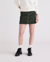 Front view of model wearing Deep Forest Button Front Mini Skirt.