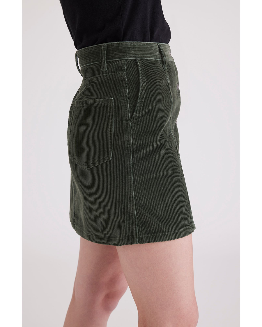 Side view of model wearing Deep Forest Button Front Mini Skirt.