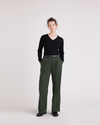 Front view of model wearing Deep Forest Pleated Pants, High Wide Fit.