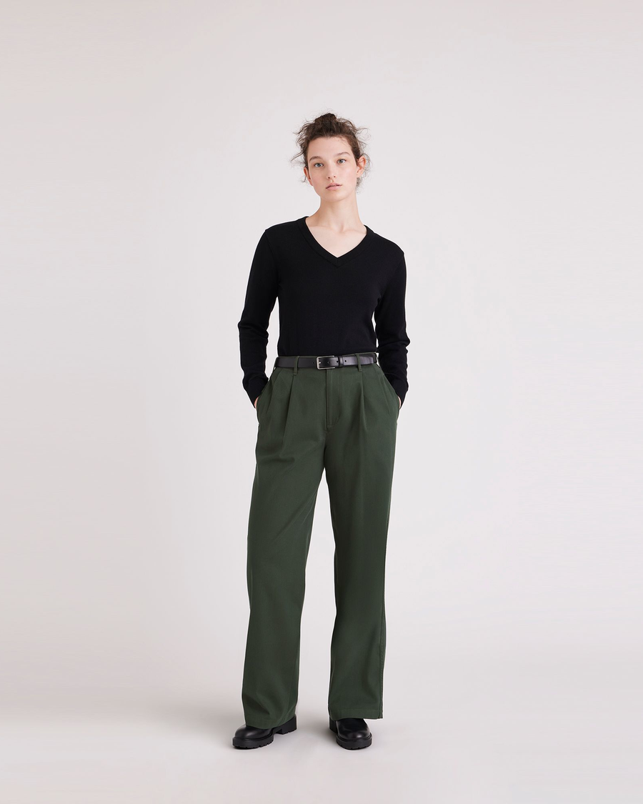 Front view of model wearing Deep Forest Pleated Pants, High Wide Fit.