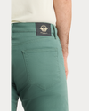 View of model wearing Duck Green Jean Cut Pants, Straight Fit.