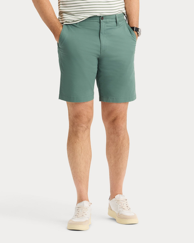 Front view of model wearing Duck Green Ultimate 9.5" Shorts, Straight Fit.