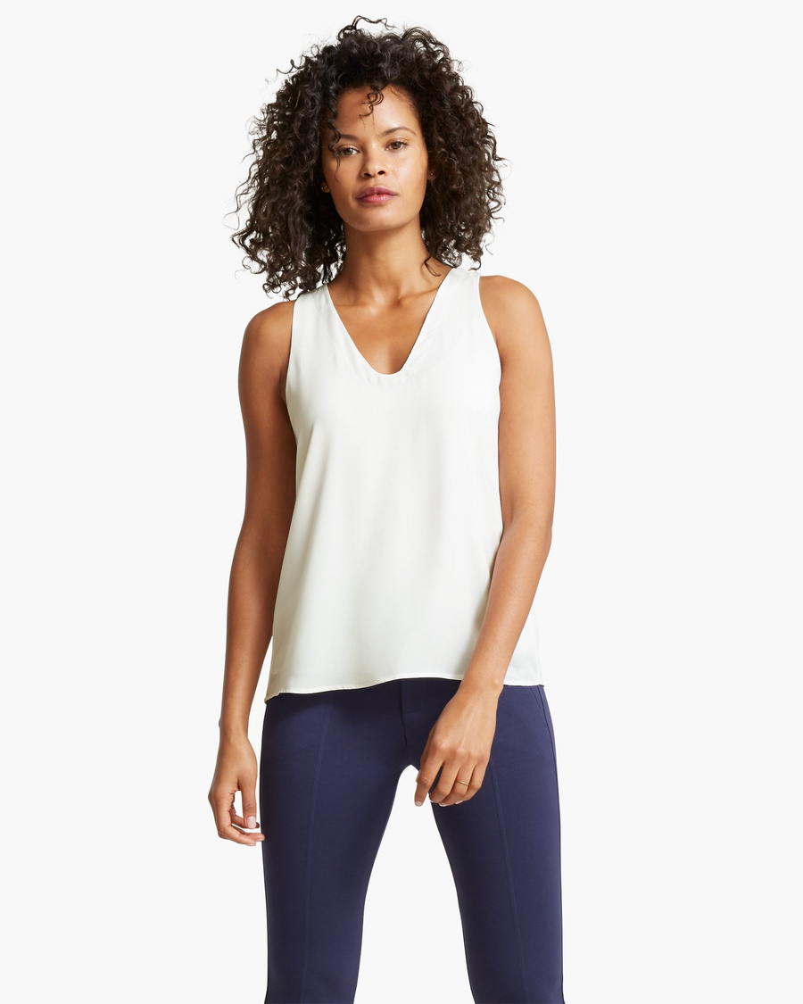 Front view of model wearing Egret Back Detail Tank Top.