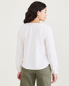 Back view of model wearing Egret Wrap Blouse, Regular Fit.