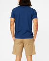 Back view of model wearing Estate Blue Alpha Logo T-Shirt, Slim Fit.