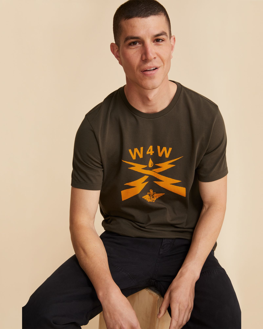 View of model wearing Fern & Gold Waves for Water Graphic Tee, Slim Fit.