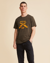 Front view of model wearing Fern & Gold Waves for Water Graphic Tee, Slim Fit.