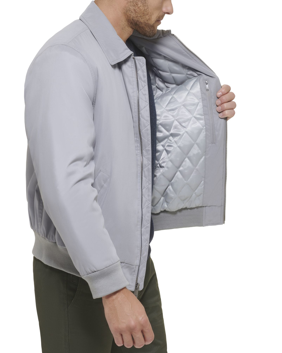 View of model wearing Foil Microtwill Relaxed Laydown Collar Bomber.