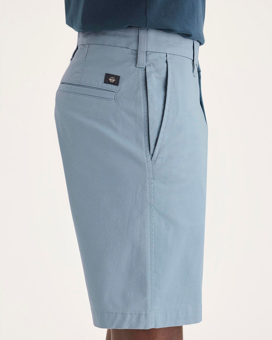 Side view of model wearing Folkstone Grey Ultimate 9.5" Shorts.