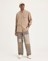 Front view of model wearing Fossil Eighty-Six Alpha Chino Patch Pants, Loose Fit.