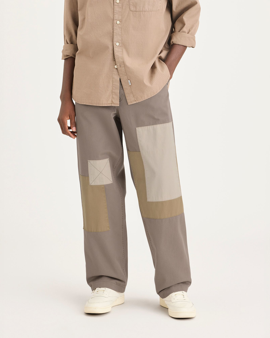 Front view of model wearing Fossil Eighty-Six Alpha Chino Patch Pants, Loose Fit.