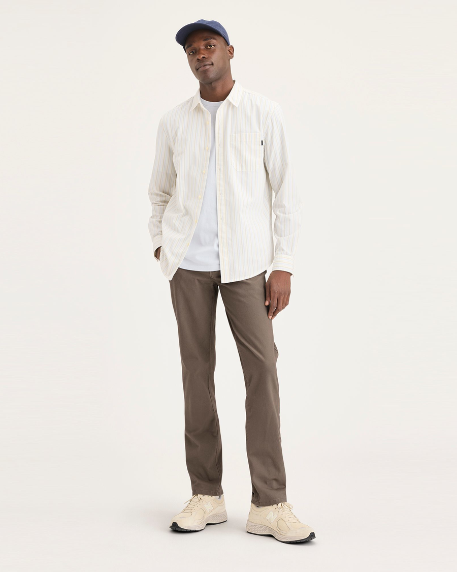 Front view of model wearing Fossil Ultimate Chinos, Slim Fit.