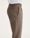 Side view of model wearing Fossil Ultimate Chinos, Slim Fit.