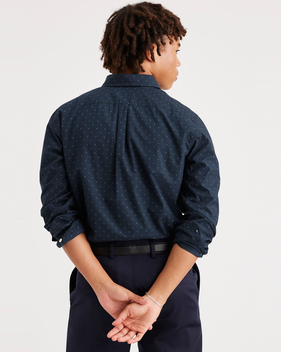 Back view of model wearing Glimmer Navy Blazer Essential Button-Up Shirt, Classic Fit.