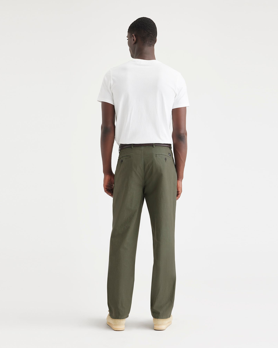 Back view of model wearing Green Crisp Original Chinos, Relaxed Tapered Fit.