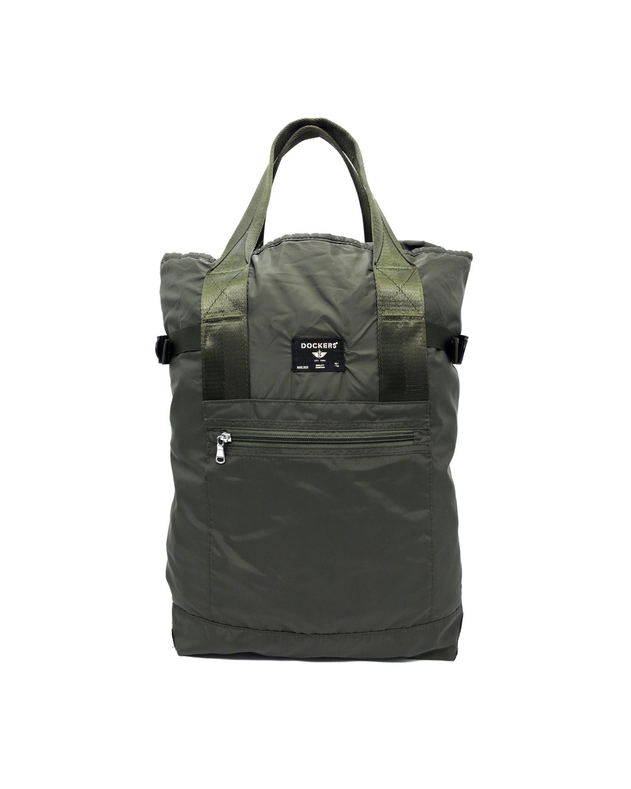 Front view of model wearing Green Packable Backpack.