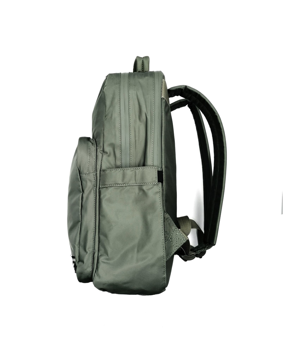 View of model wearing Green Standard Backpack, 20 L.