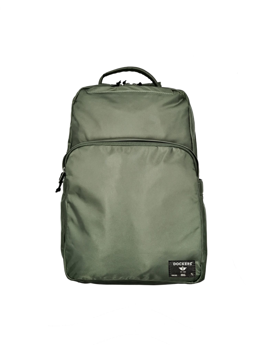 Front view of model wearing Green Standard Backpack, 20 L.