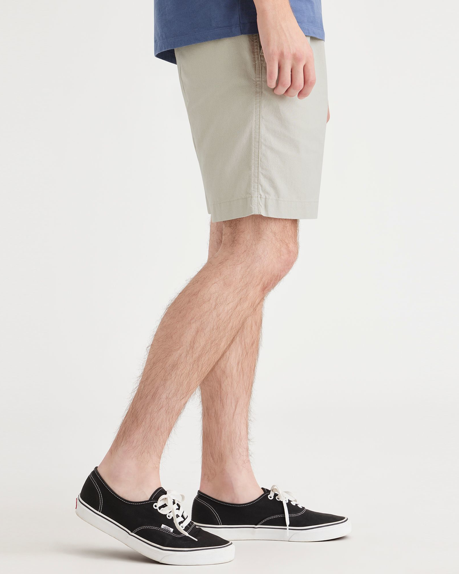 Side view of model wearing Grit Playa 7.5" Shorts.