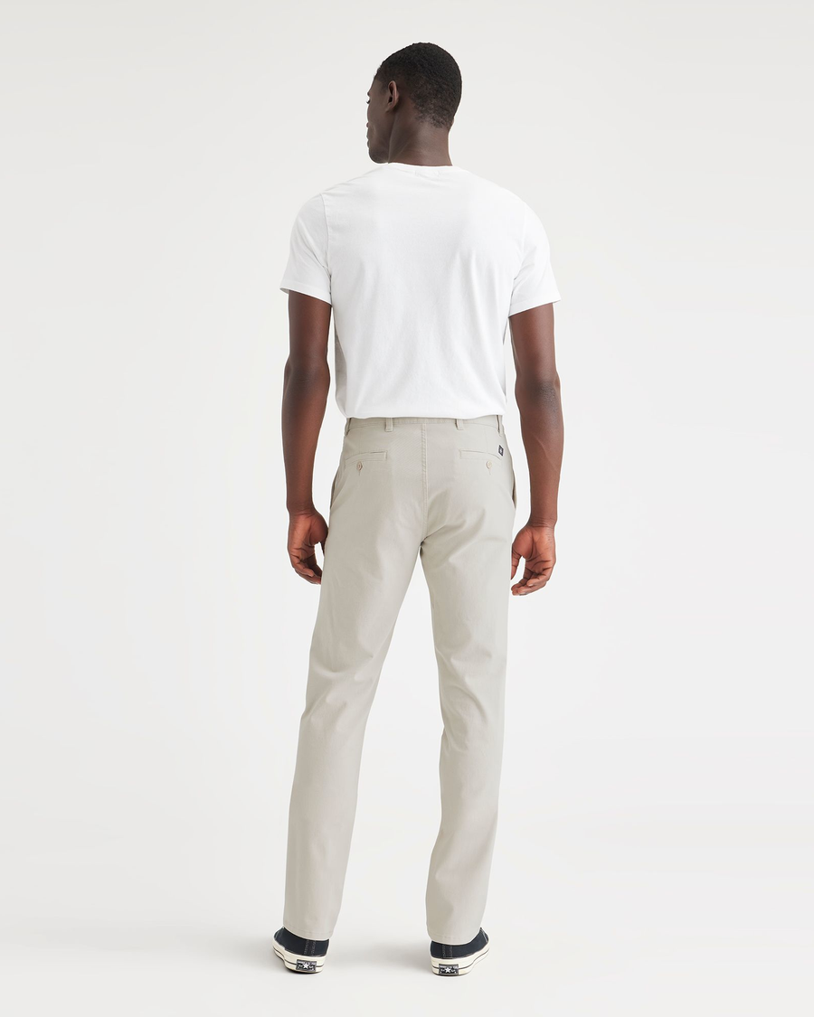 Back view of model wearing Grit Ultimate Chinos, Slim Fit.
