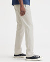 Side view of model wearing Grit Ultimate Chinos, Slim Fit.