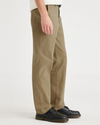 Side view of model wearing Harvest Gold Alpha Chino, Straight Fit.