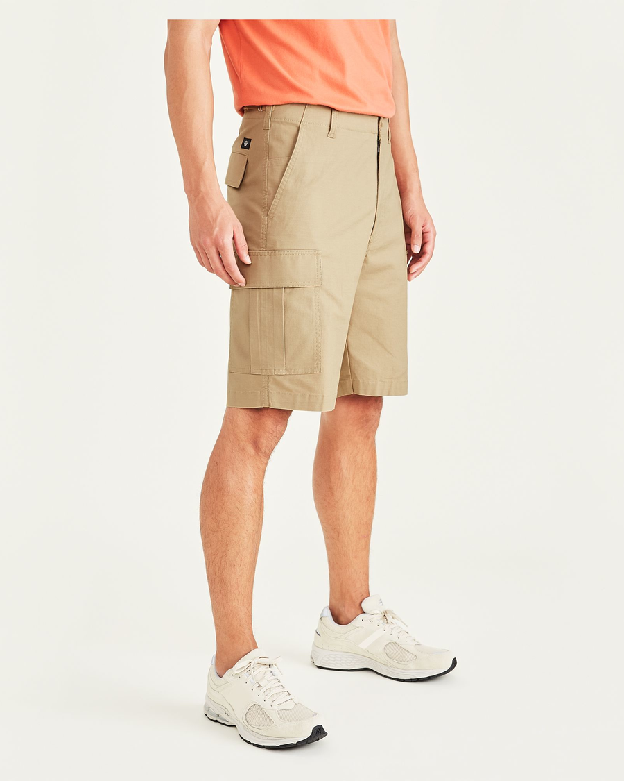 Side view of model wearing Harvest Gold Cargo 9" Shorts, Straight Fit.