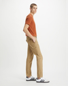 Side view of model wearing Harvest Gold Cargo Pants, Slim Tapered Fit.